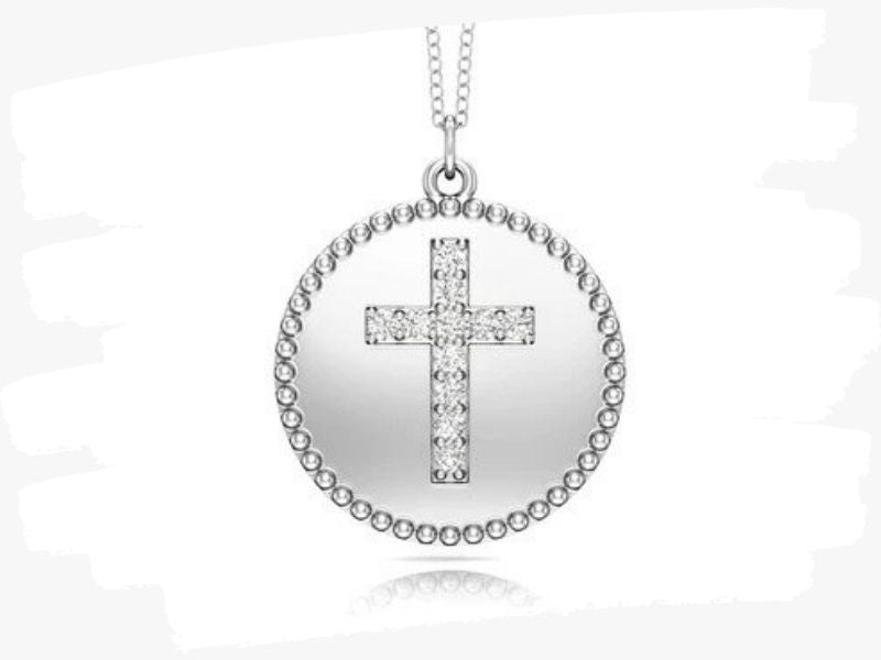 white gold disc cross pendant with a necklace