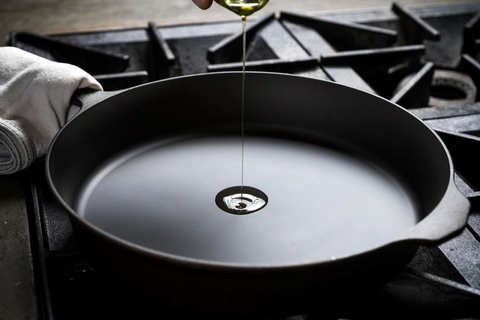 Field Skillet on a stovetop with a drop of oil