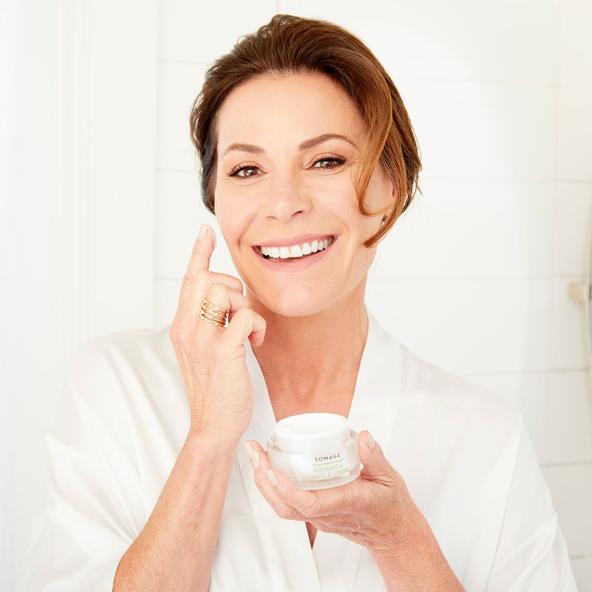 woman holding botanica souffle creme