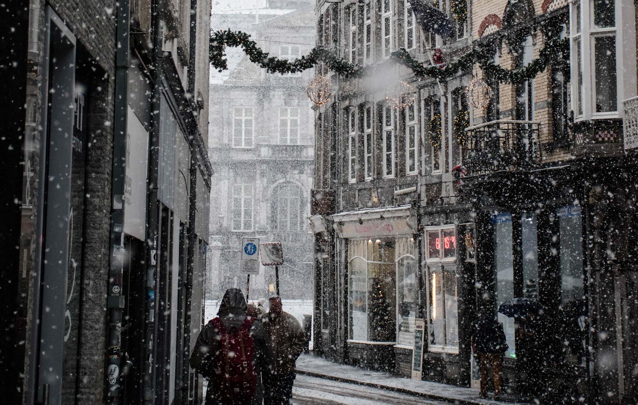 men walking in snowy london