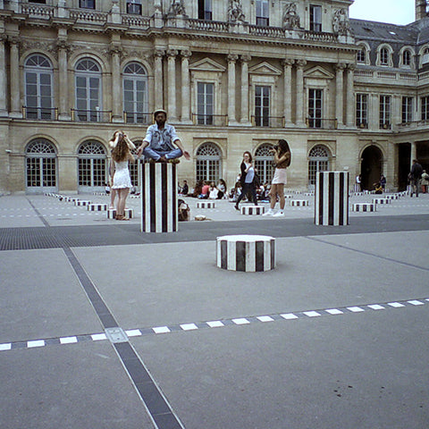 Travel with Father's Factory wooden digital camera. Capture the moment with father's factory camera for kids. picture shows the photographer's father sitting in a square in Paris. Little photographer took the photo with Father's Factory wooden digital camera.