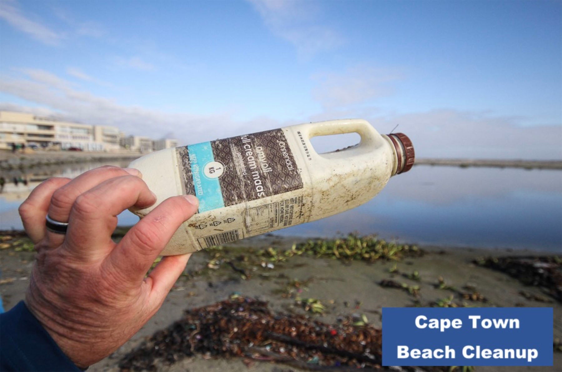 Photo of beach clean up in South Africa. The Cape Island brand supports this cause. Cape Island luxury candles, soap products and home fragrances are available at Sarza home goods and furniture store in Rye New York.