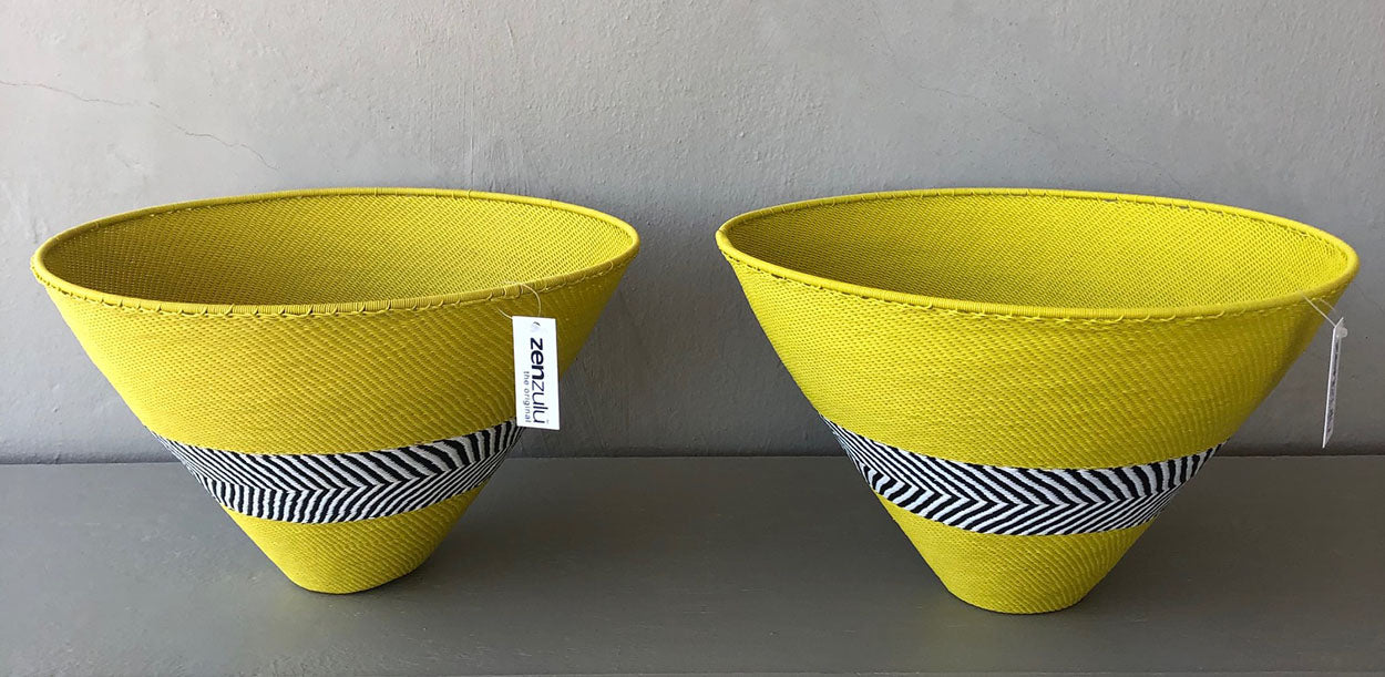 Image of ZenZulu yellow woven baskets as home décor products. ZenZulu baskets, plates and vessels are available at Sarza home goods and furniture store in Rye New York. 