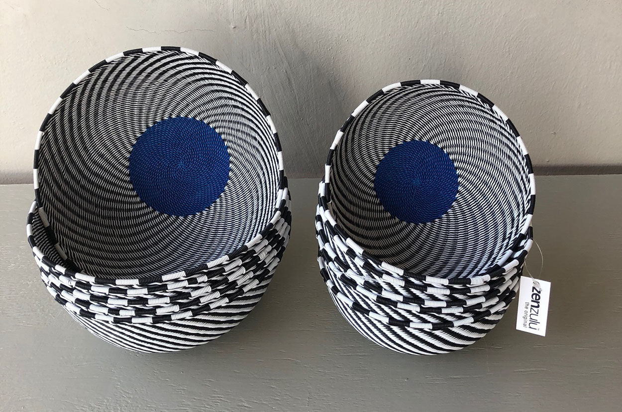 Image of ZenZulu black, white and blue woven baskets as home décor products. ZenZulu baskets, plates and vessels are available at Sarza home goods and furniture store in Rye New York. 