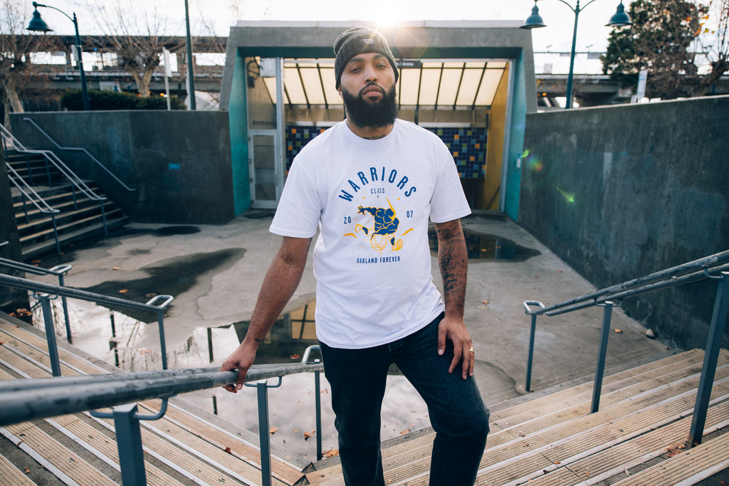 Male model, white tee with Thunder rendition.