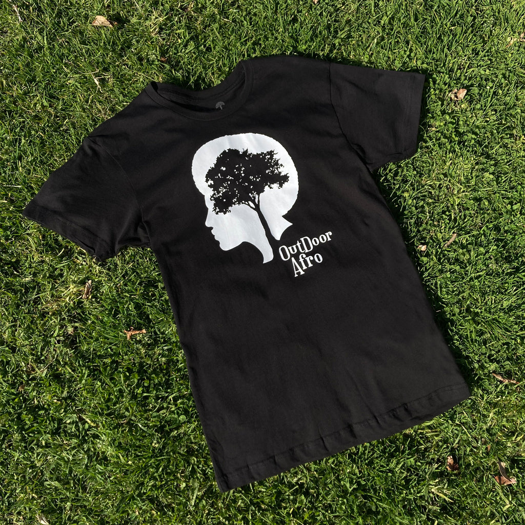 Image of black short sleeve Outdoor Afro tee photographed on grass.