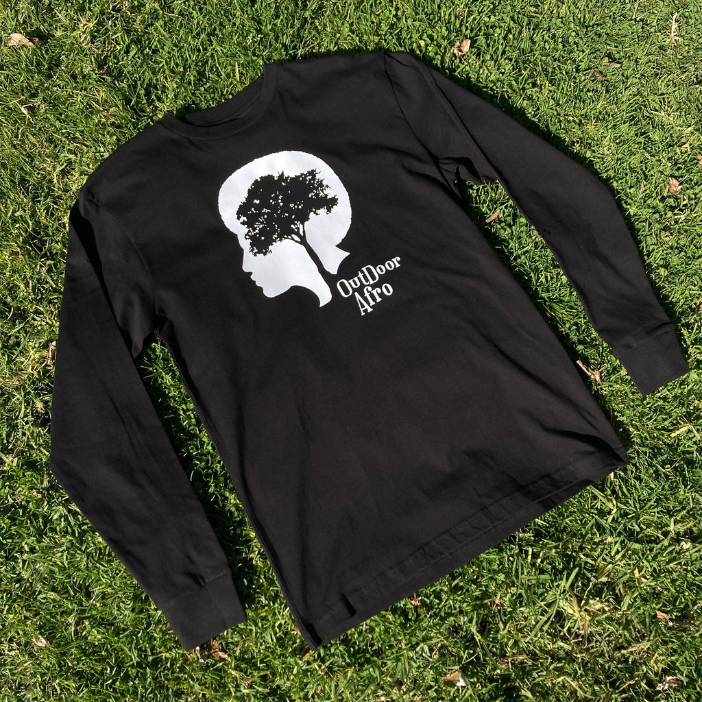 Image of black long sleeve Outdoor Afro t-shirt photographed on grass.