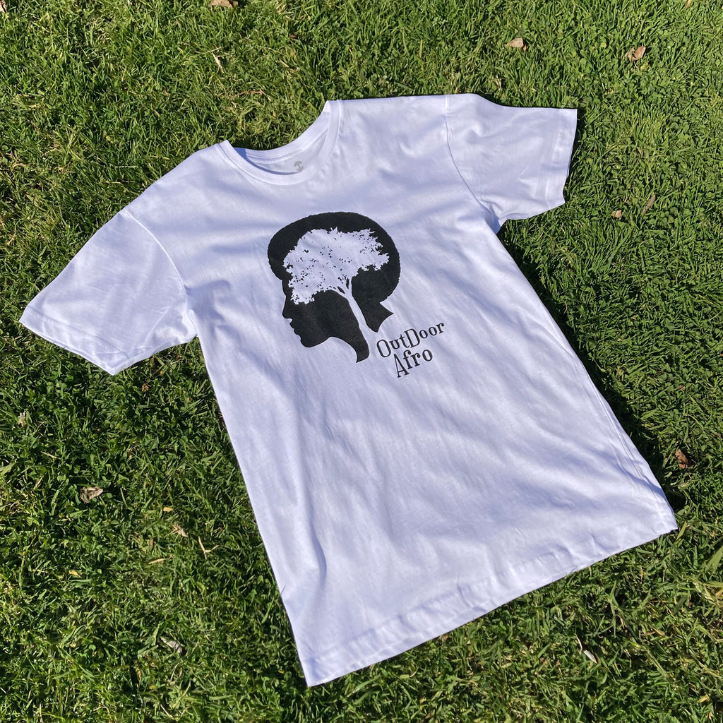 Image of white short sleeve Outdoor Afro t-shirt photographed on grass.