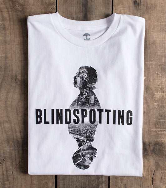 White tee, Blindspotting text, with photo contained inside silhouettes above and below text.