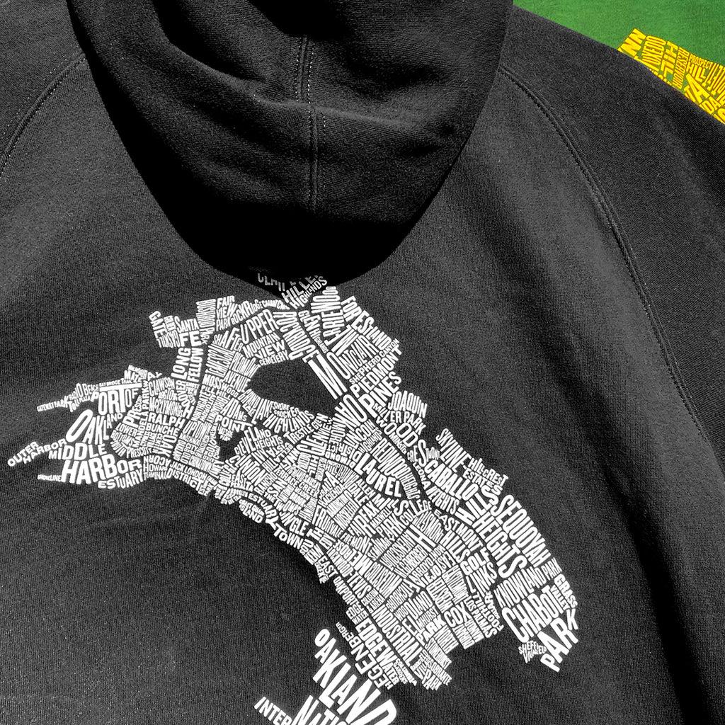 Closeup of the back of the all-Oakland black hoody.