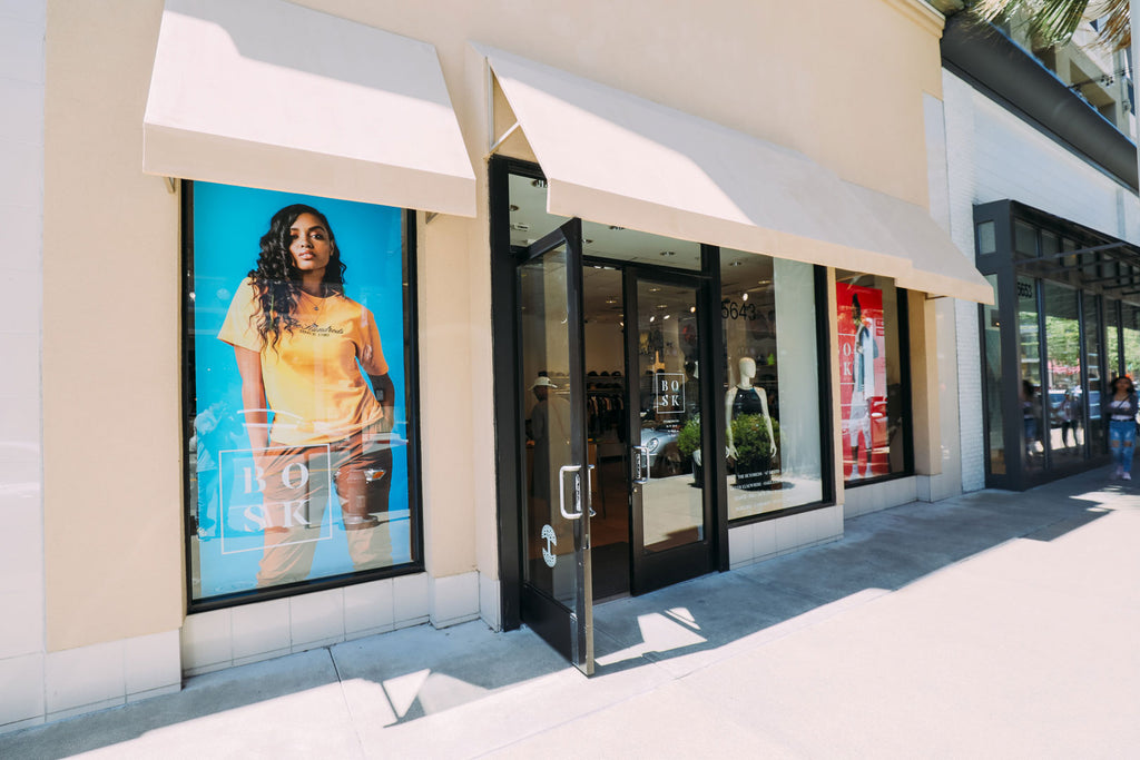 Exterior storefront with large photo of Shotta.