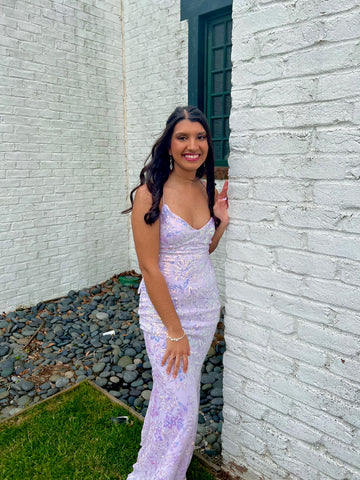 picture of scholarship winner, sohni kothari, in a lavender prom dress posed outside her home