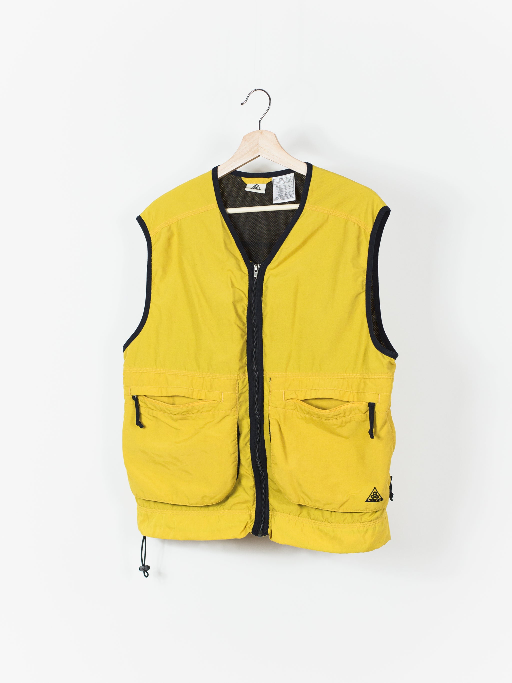 yellow nike vest