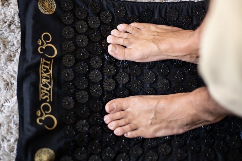 Standing on the ShaktiMat acupressure mat acts like a foot reflexology massage