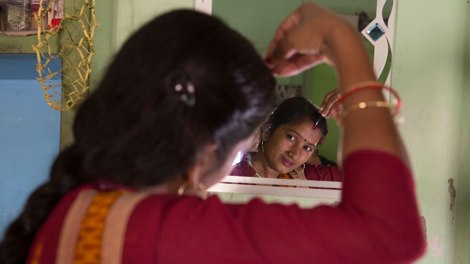 The production worker at Gratitude Factory in Varanasi gets ready to start her workday.