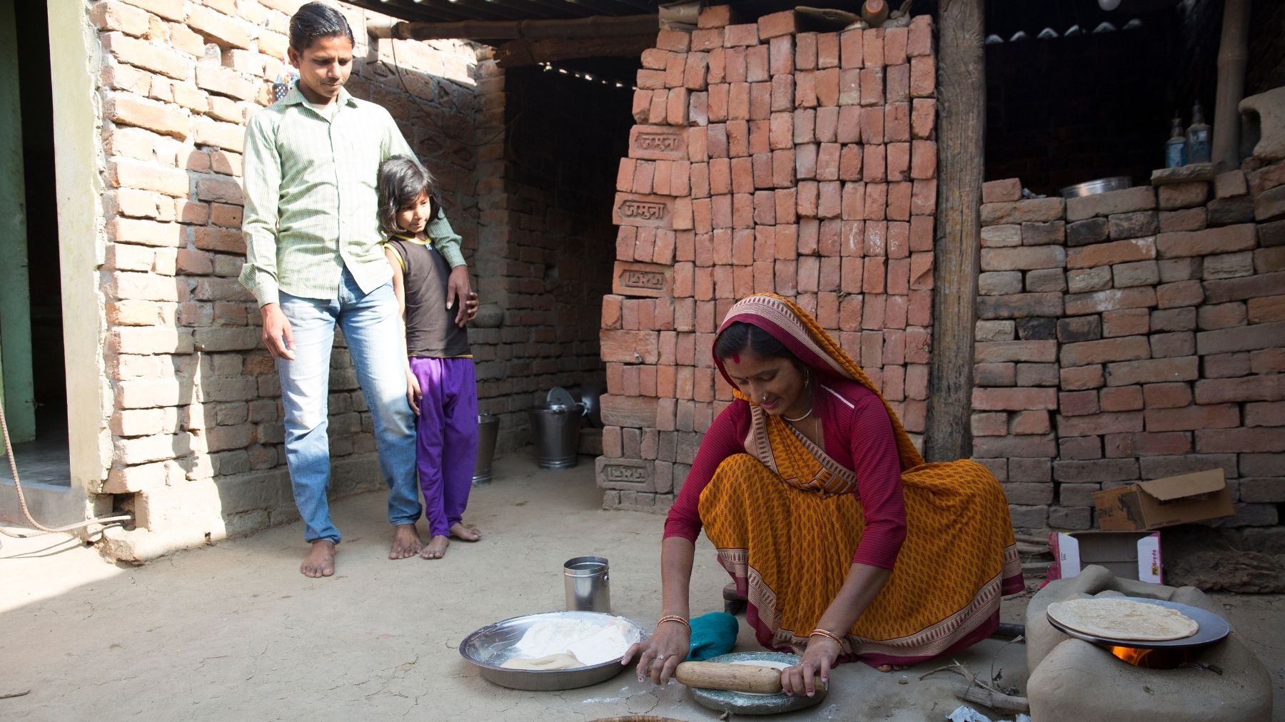 At home with the Devi family. Aarti prepares breakfast for her husband, children and mother-in-law.