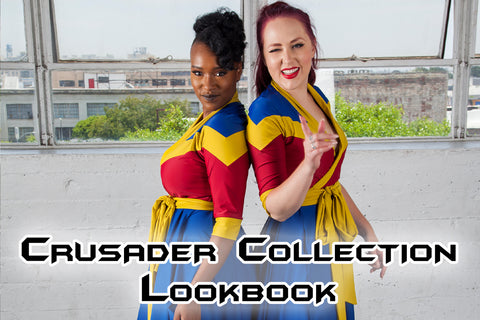 Crusader Collection - Lynsi (a dark skinned model with dark hair) and Kelsey (a light skinned model with red hair) wear the blue, yellow, and red wrap dress from our Crusader Collection, inspired by comics with a team great for distributing justice.