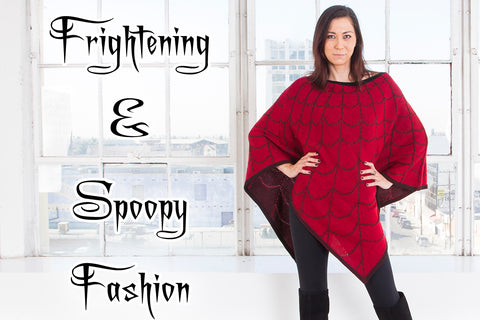 Frightening & Spoopy Fashion - Susan (a medium light skinned model with dark hair) models the red poncho with black spiderwebs, part of our Frightening and Spoopy Collection which is inspired by some creepy, ghostly, strange, and unusual characters.
