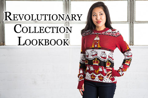 Revolutionary Collection Lookbook - Kate (a medium skinned, dark haired model) wears a revolutionary inspired sweater fit for a king. She is standing in front of a white wall with windows.
