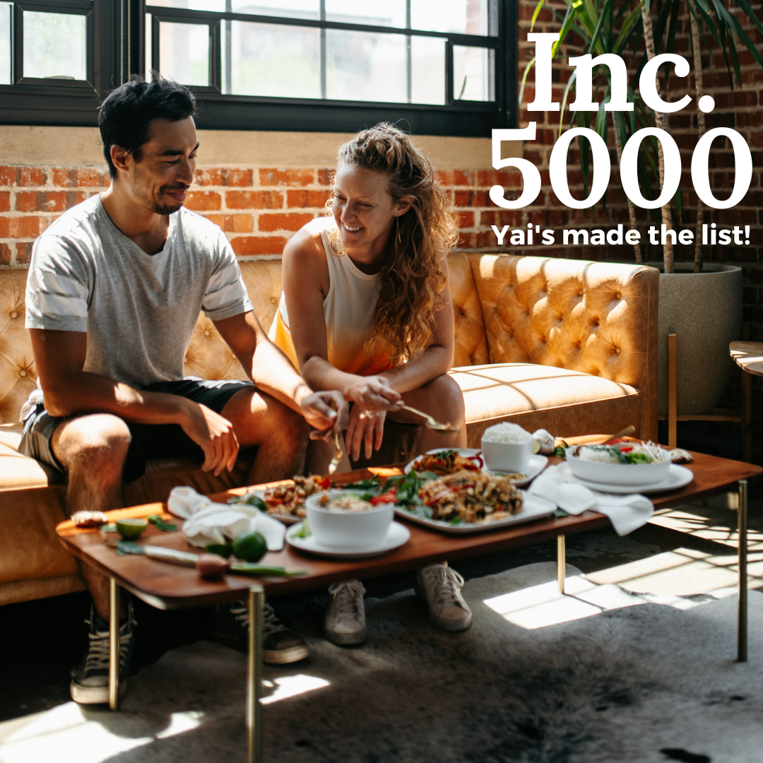 Inc. 5000 - Yai's made the list! Founders Leland and Sarah sit on a couch eating a DIY Thai feast