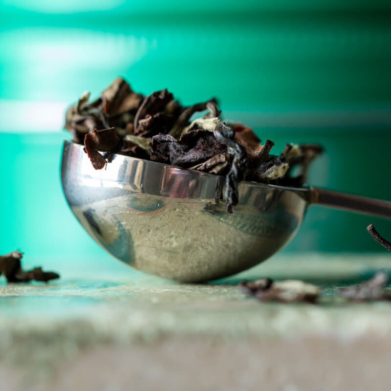 Perfect teaspoon filled with loose leaf tea.