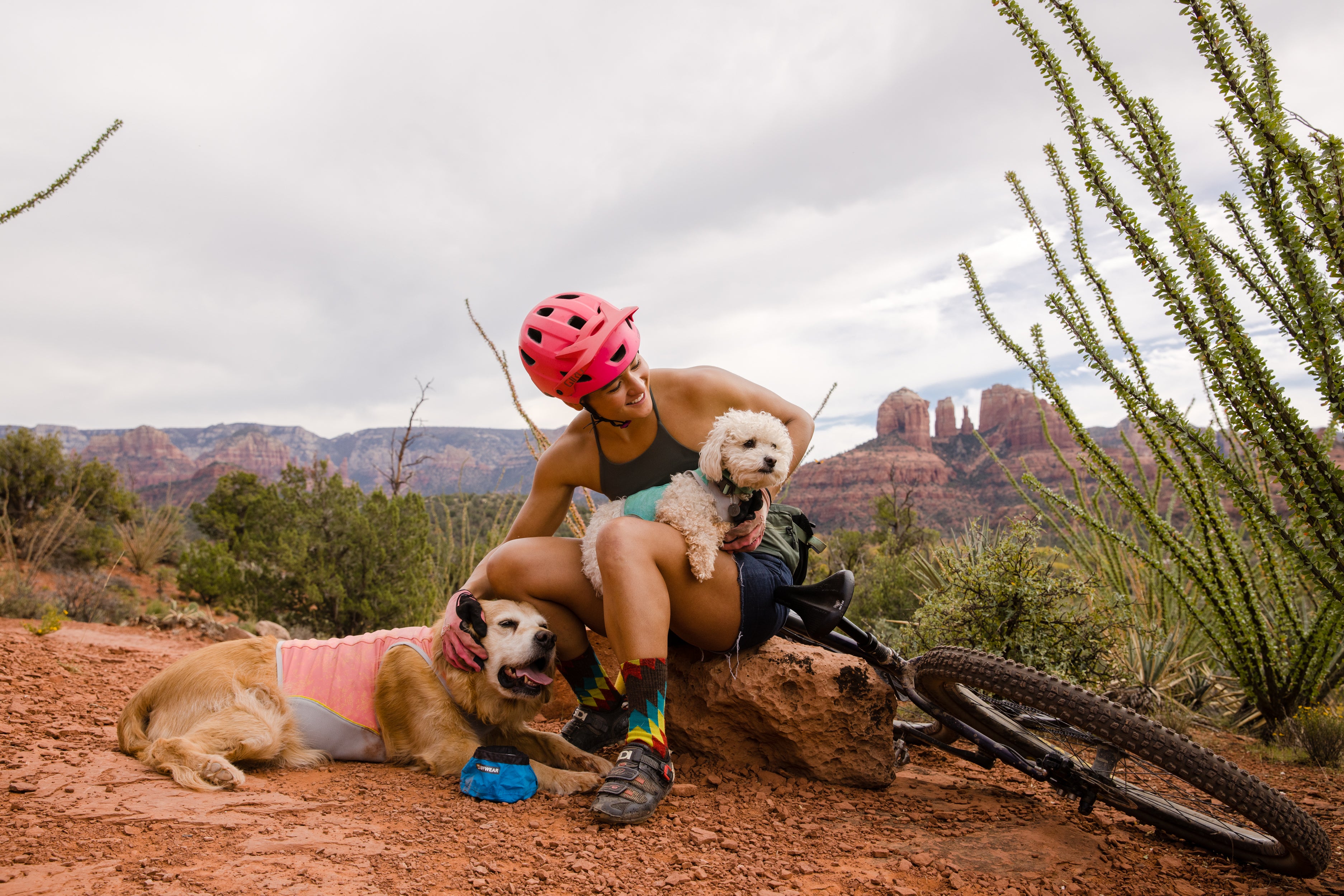 Abby, Kona, and Mochi sitting and taking a break from mountain biking