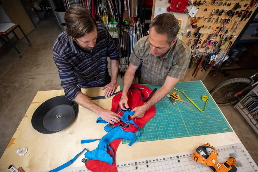 Product team members make a prototype of a harness jacket fuse.
