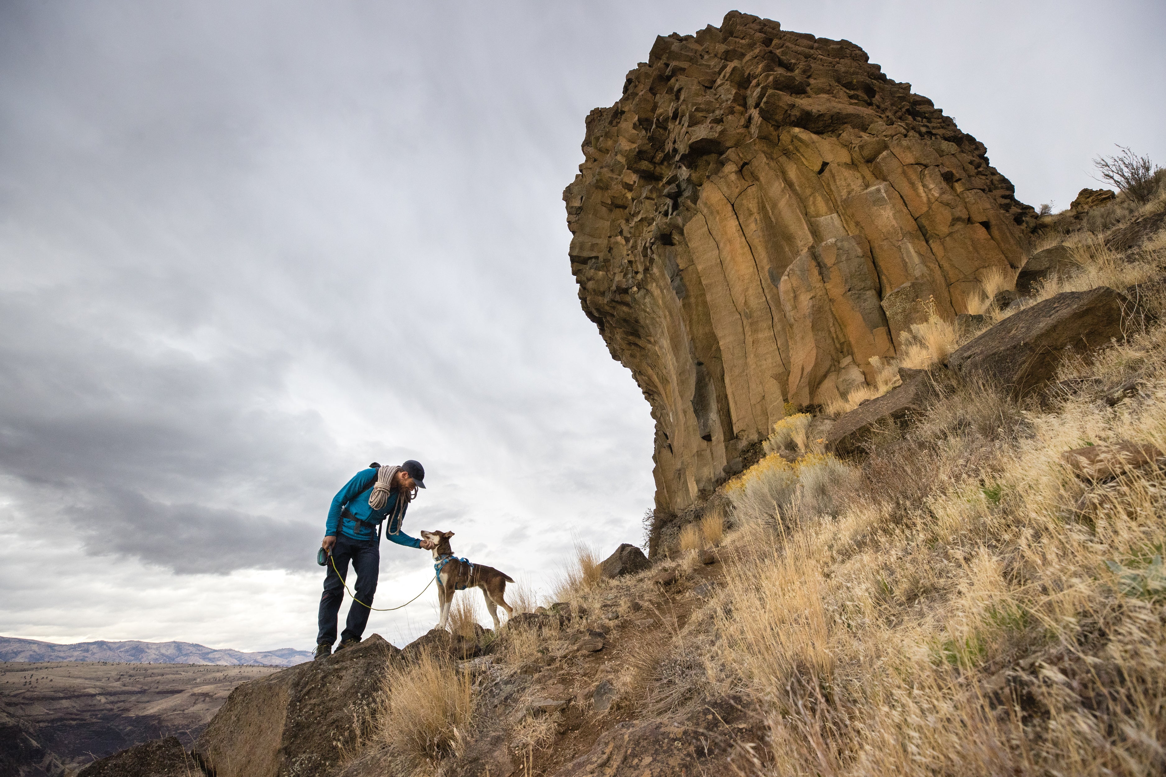 Max and his dog Billy take a break while hiking at Trout Creek