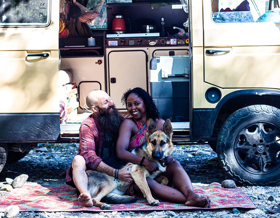 Dustin, Noami, and Amara outside their van.