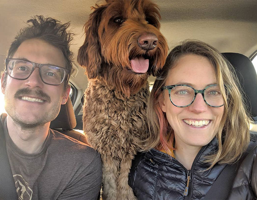 Graham, Shannon, and Pebble in the car on an adventure.