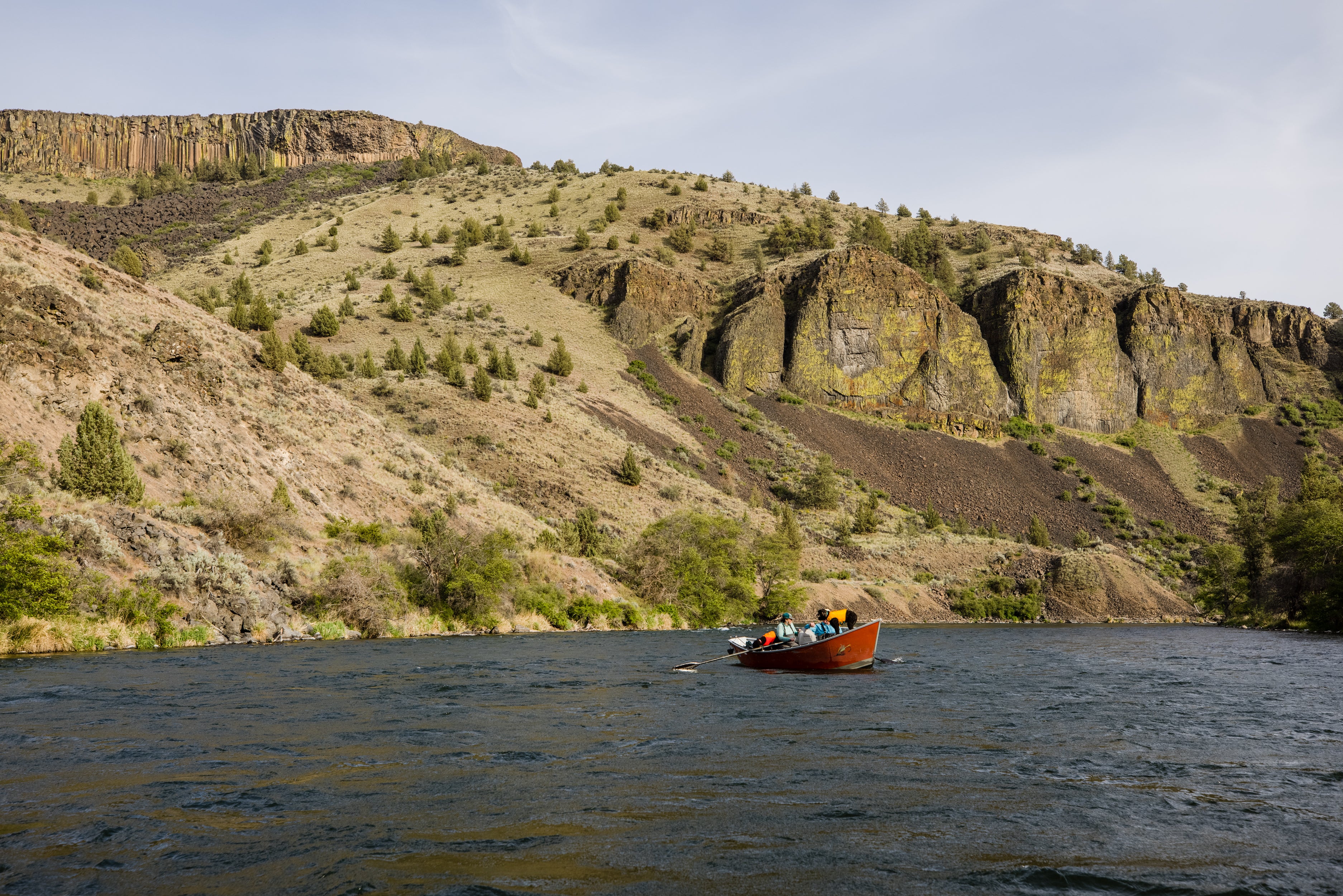 Dove and family in boat in the canyon of the deschutes.