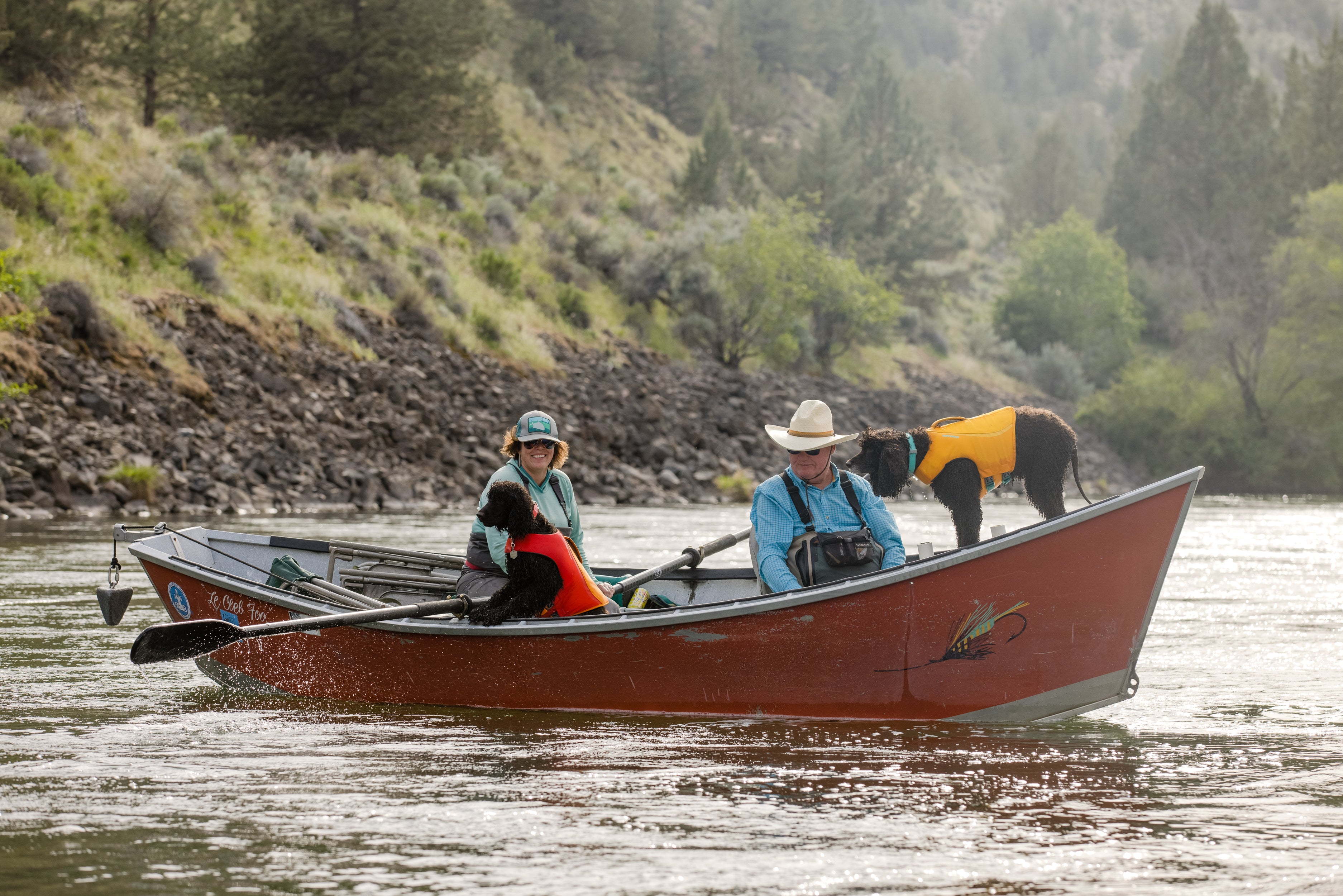 Dove, Clell and dogs in the fishing boat.