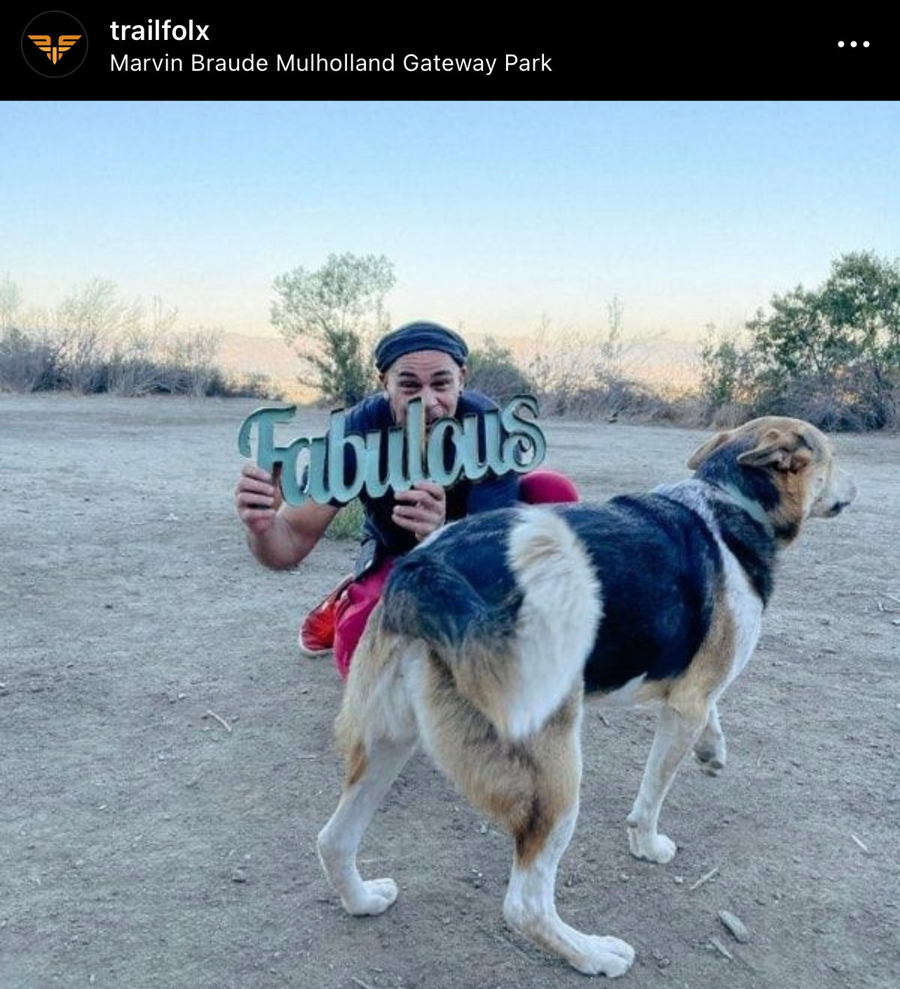 Instagram post from Trail Folx showing a person and dog posing with a sign that says fabulous