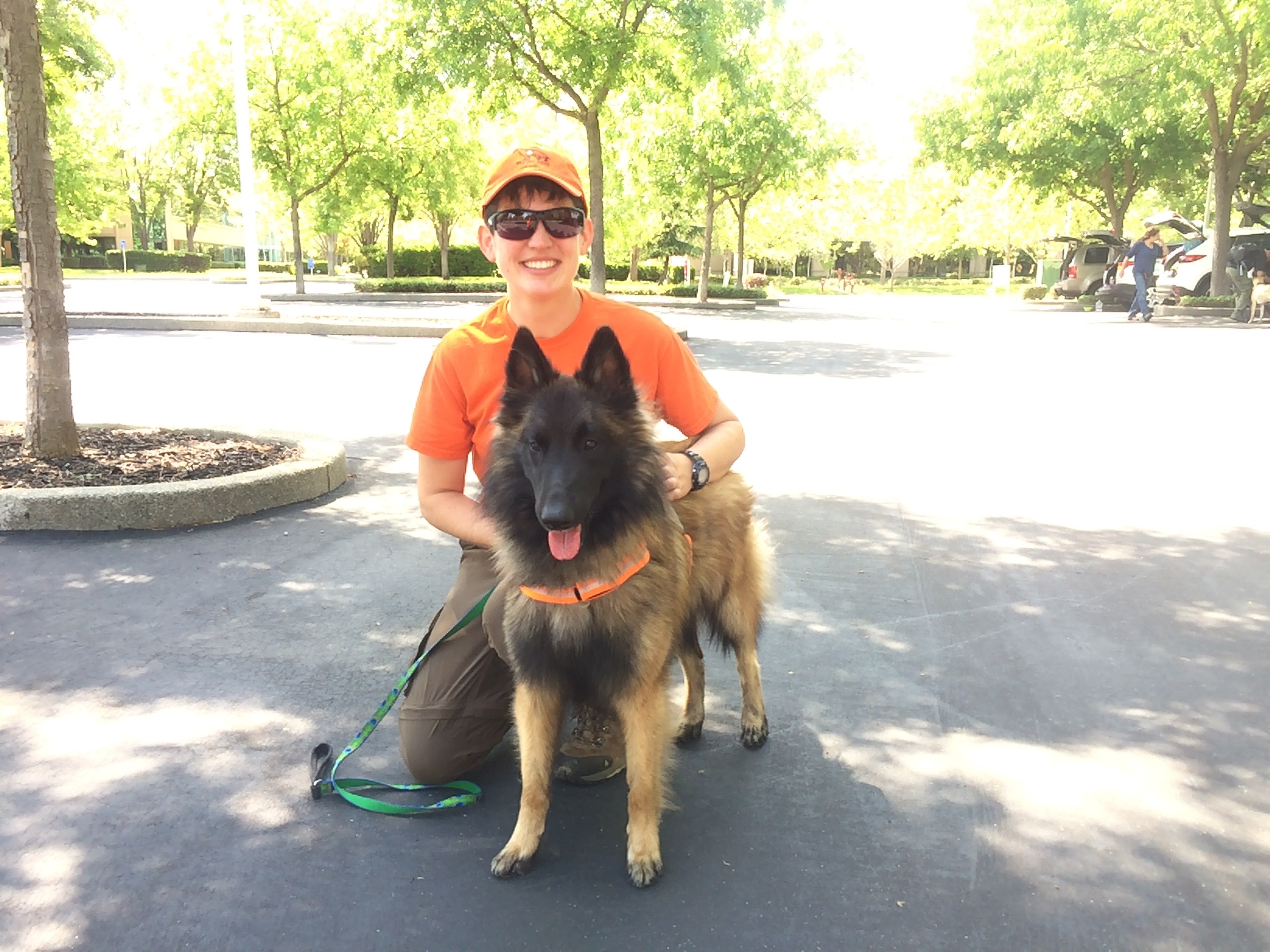 A woman poses with her search and rescue dog. 