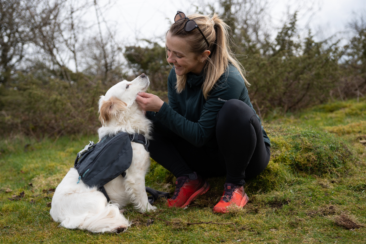 Woman petting her dog.