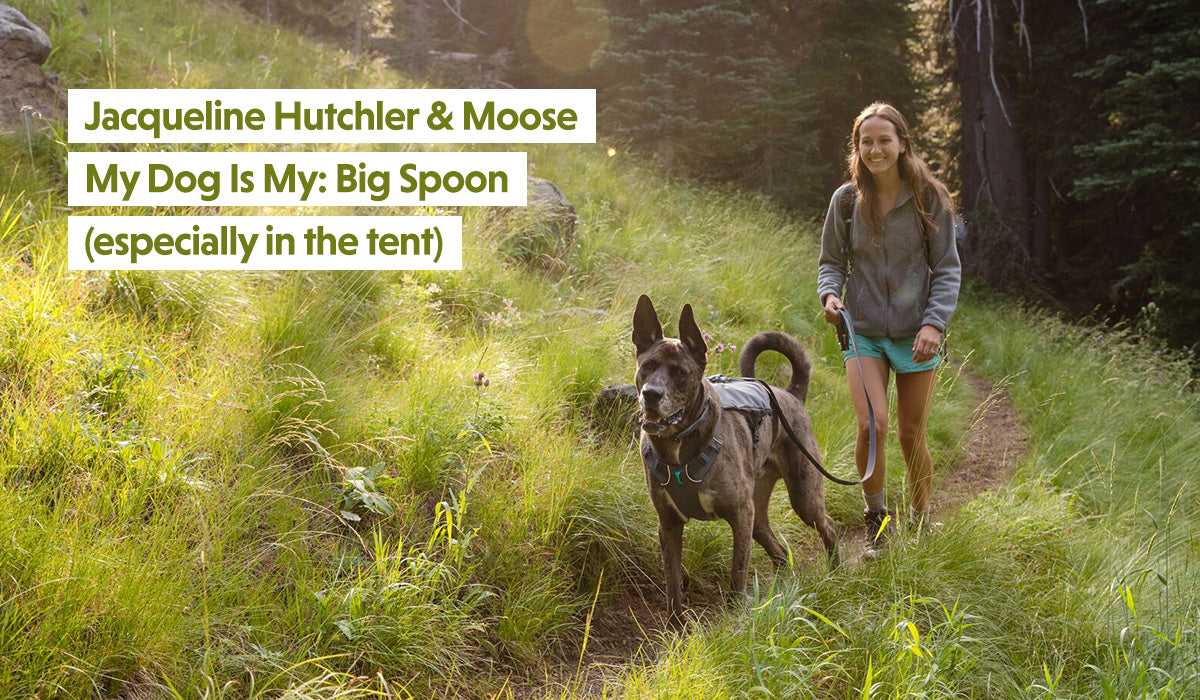 Jacqueline walks behind Moose on trail