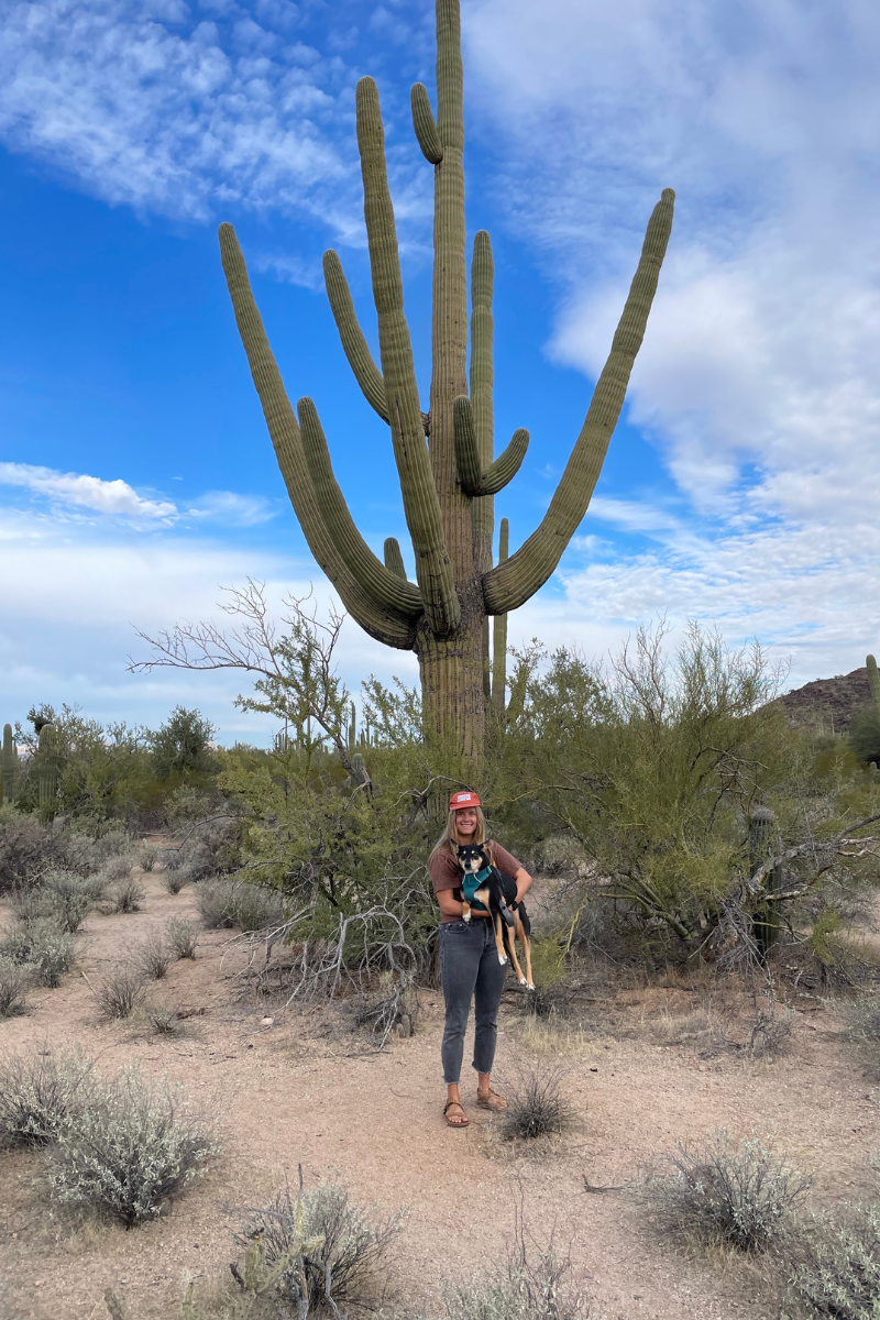 Kaylin and Willow in front of a saguaro at Saguaro National Park.