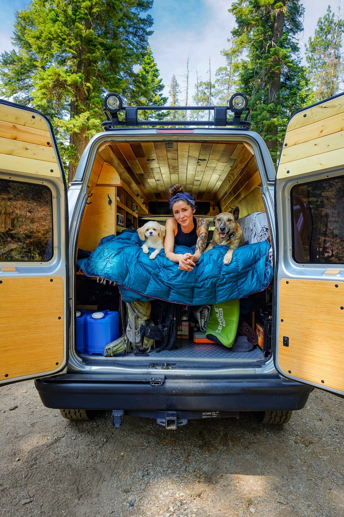 Noel and her dogs in the back of her camper van