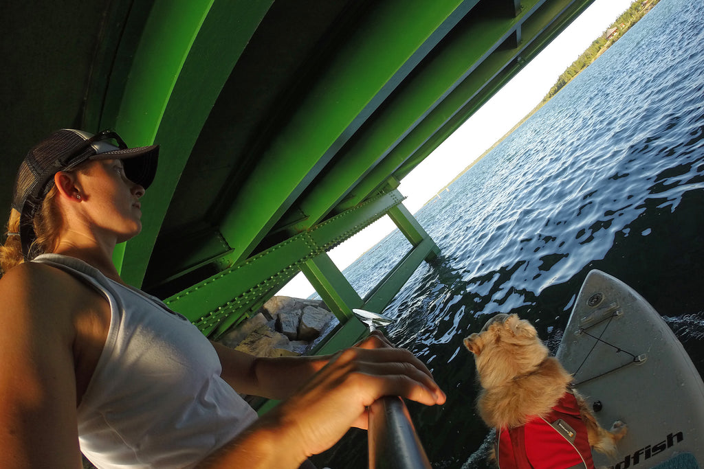 Maria and Riley paddling under the Mackinac Bridge from Lake Huron into Lake Michigan. 