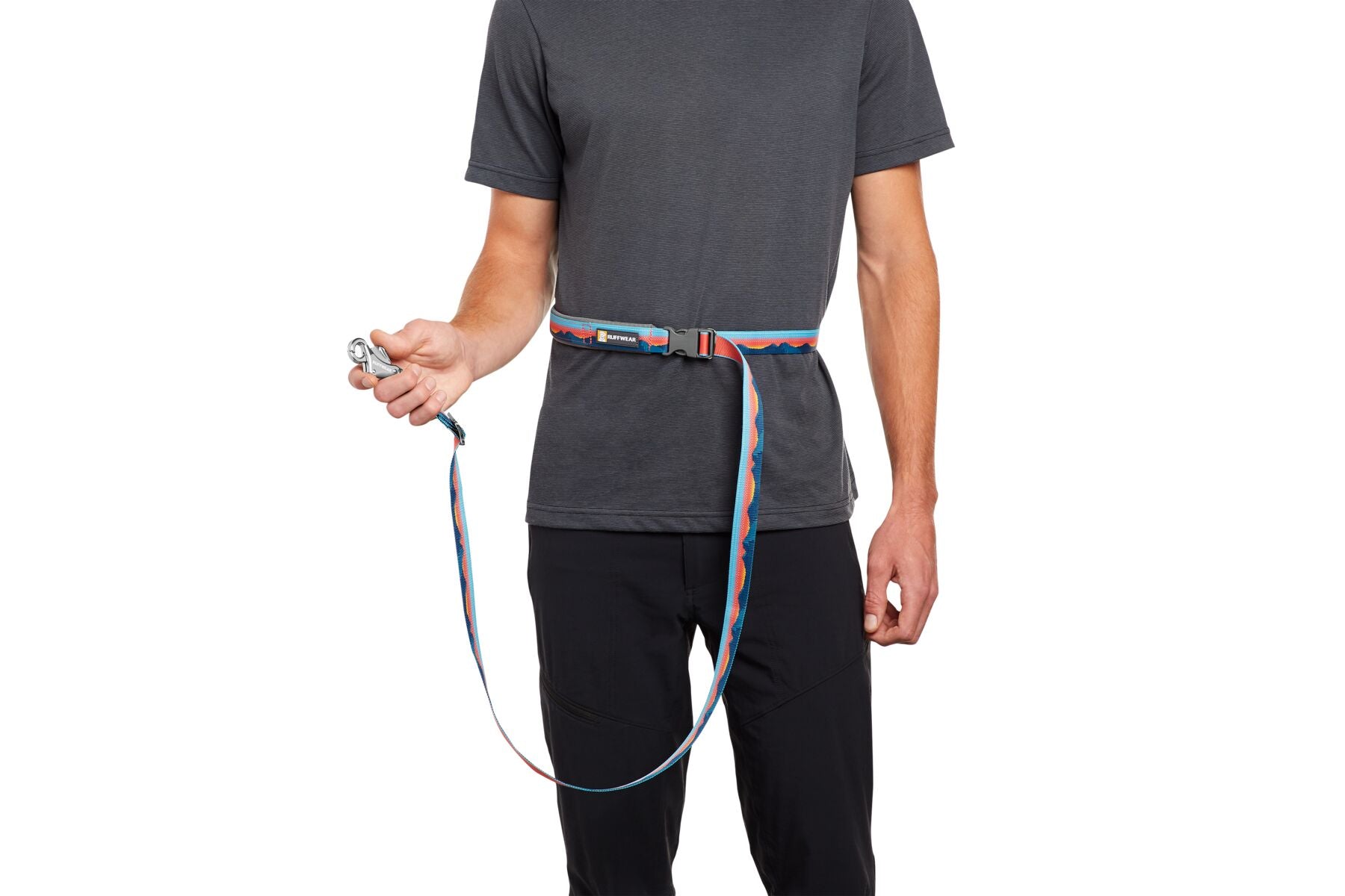 A man wears a Ruffwear Crag™ Reflective Leash around his waist.