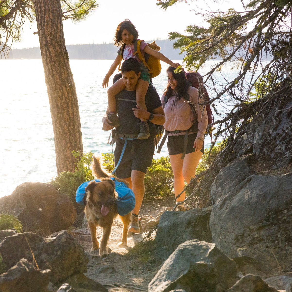 Family hiking with a dog