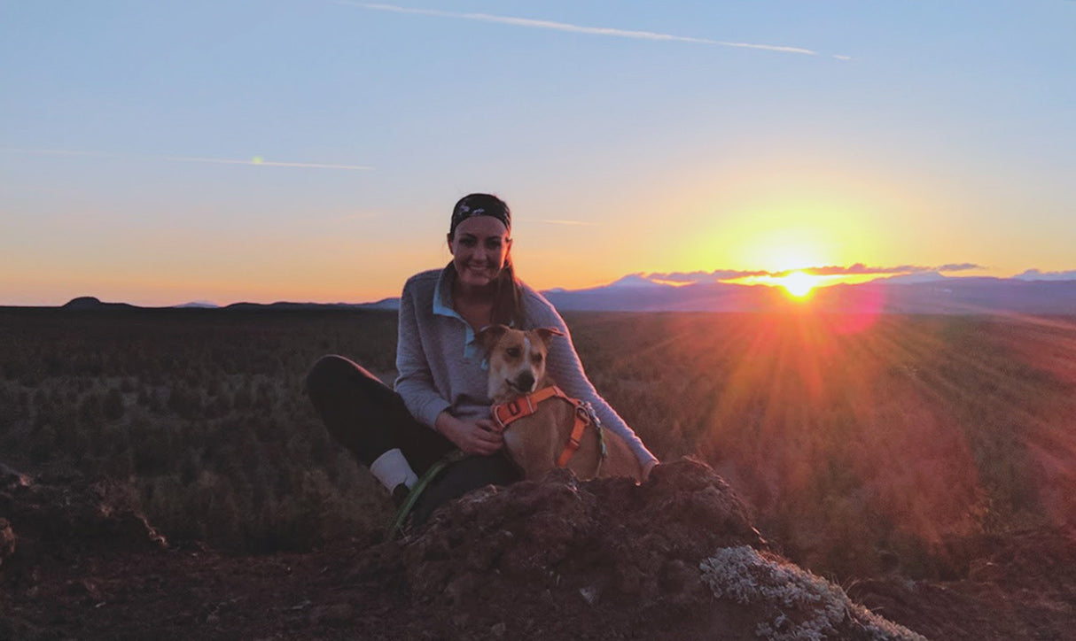 Monica and Giles at sunrise up on a hill.