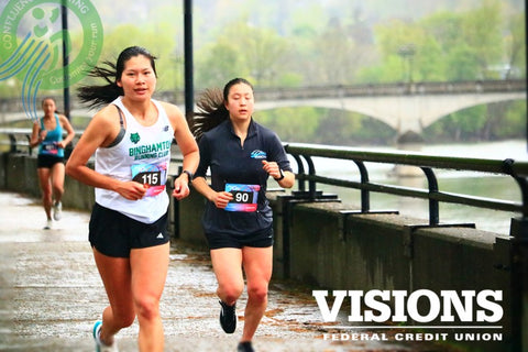 Marie Collins running in the Binghamton Bridge Run as part of the Binghamton University Running Club