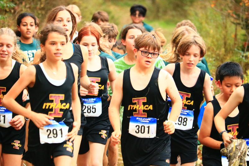 Arlo running cross country with his team