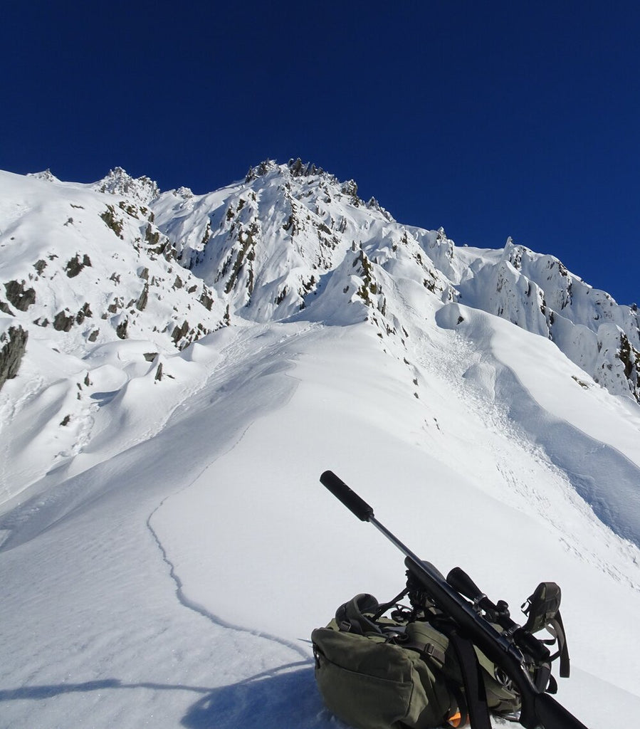 winter hunting rifle in snow