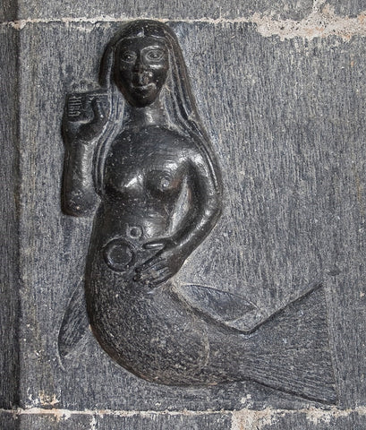 Clonfert Cathedral, Clonfert, County Galway, Ireland 15th-century carving of a mermaid with comb and mirror at the southern pier of the chancel arch.