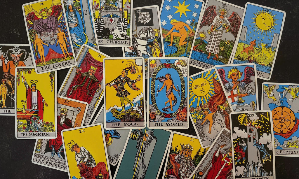 Rider-Waite-Smith tarot's major arcana spread out on a black background.