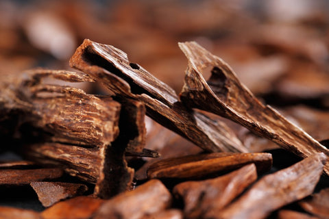 Closeup of sandalwood chips. In most Arab countries bukhoor is the name given to scented bricks or wood chips. These scented chips or bricks are burned in incense burners to perfume the home and clothing with a rich thick smoke