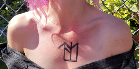 Alesia the master crafter wearing our Libra season bind rune on her chest