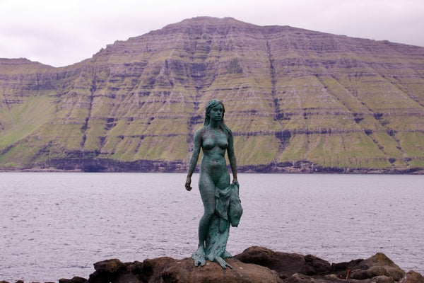 Statue of Kopakonan (the Seal Woman), view at Mikladalur village. Faroese symbol of Selkies, mythological beings capable of therianthropy.